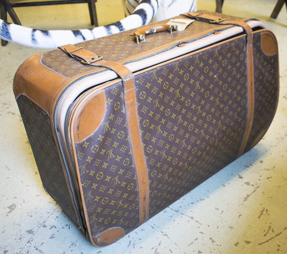 SUITCASE, with all over &#39;LV&#39; monogrammed, bears label &#39;Made in the USA under special licence to ...