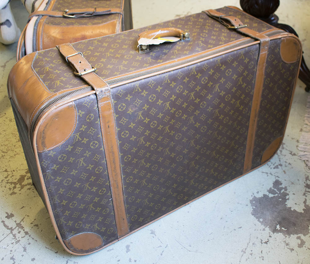 SUITCASE, with all over &#39;LV&#39; monogrammed, bears label &#39;Made in the USA under special licence to ...