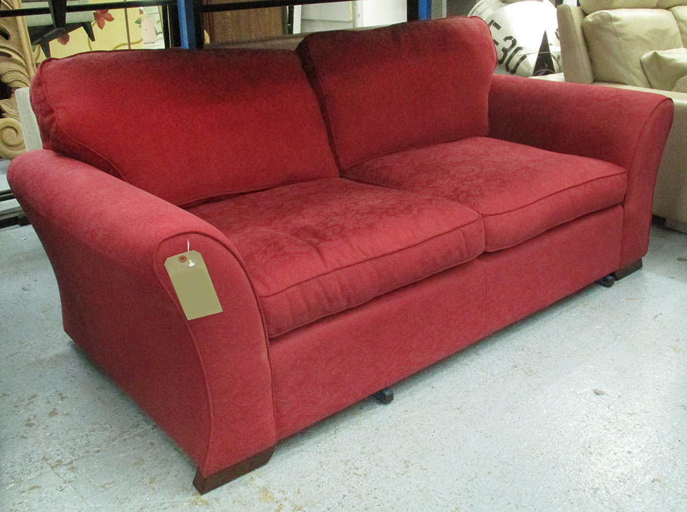 LAURA ASHLEY SOFA, two seater, in burgundy flower pattern on block