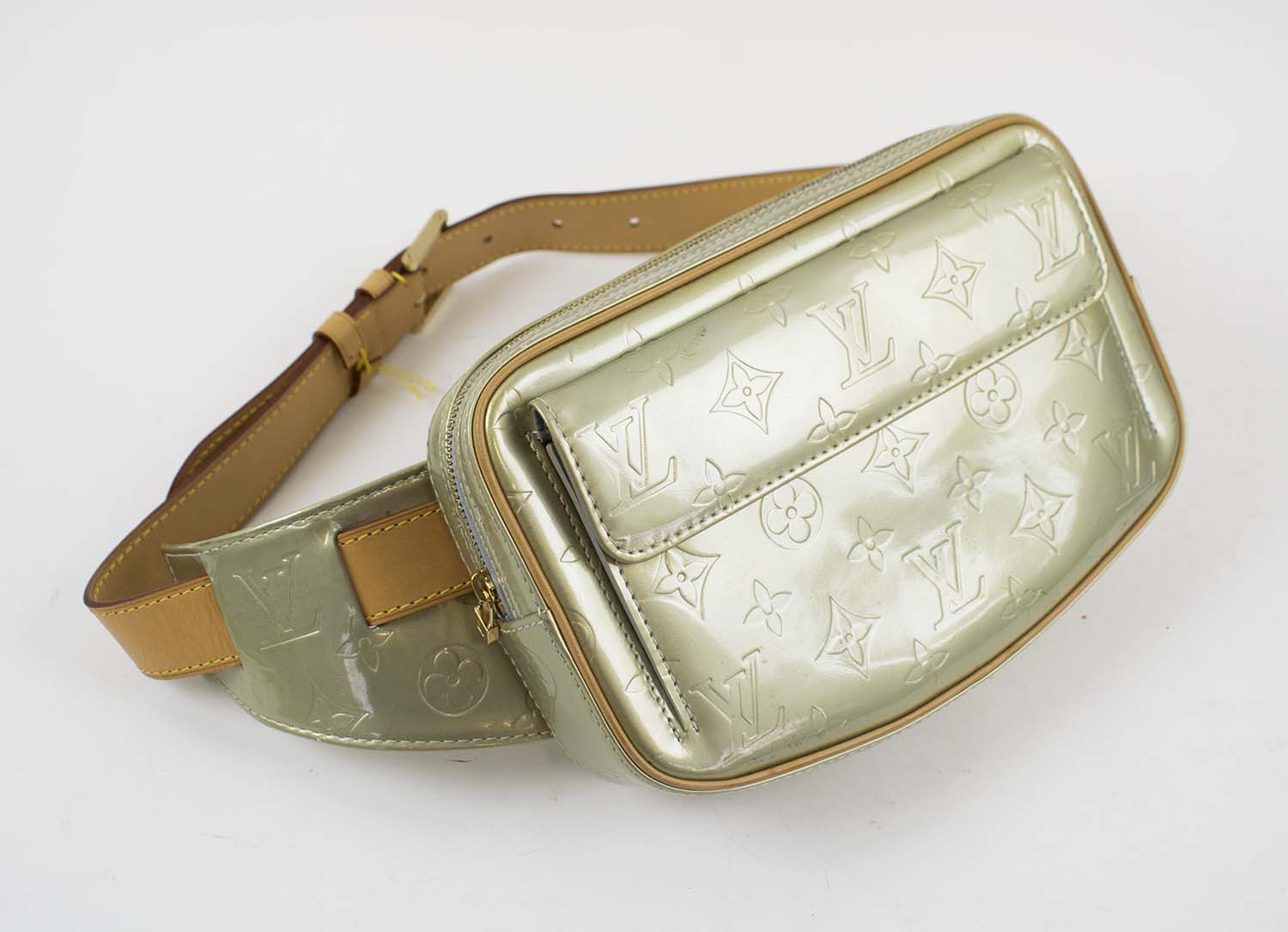 LOUIS VUITTON VERNIS FULTON WAIST BAG, gold patent vernis monogram leather  with leather trims and adjustable waistband, brass tone hardware, full zip  closure and front pocket, 23cm x 14cm H x 4.5cm.