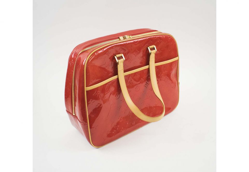 LOUIS VUITTON VERNIS RED MONOGRAM BAG, gold tone hardware, bottom feet,  leather trims and handles, full zip closure, external pocket, red leather  lining, 38cm x 32cm H x 14cm.