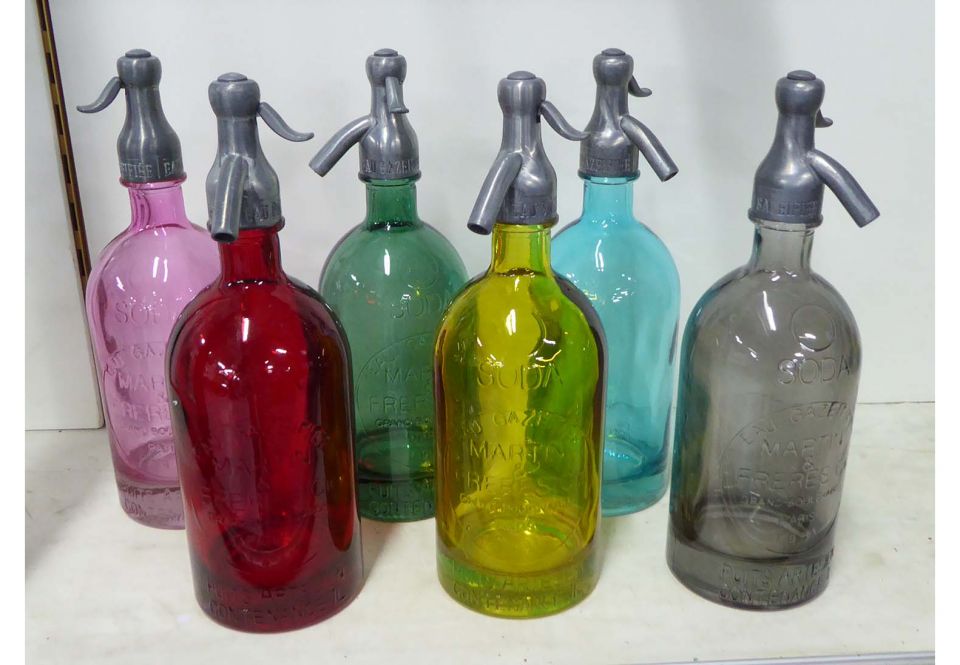 SODA SYPHONS, a set of six in various colours, 31cm H. (6)