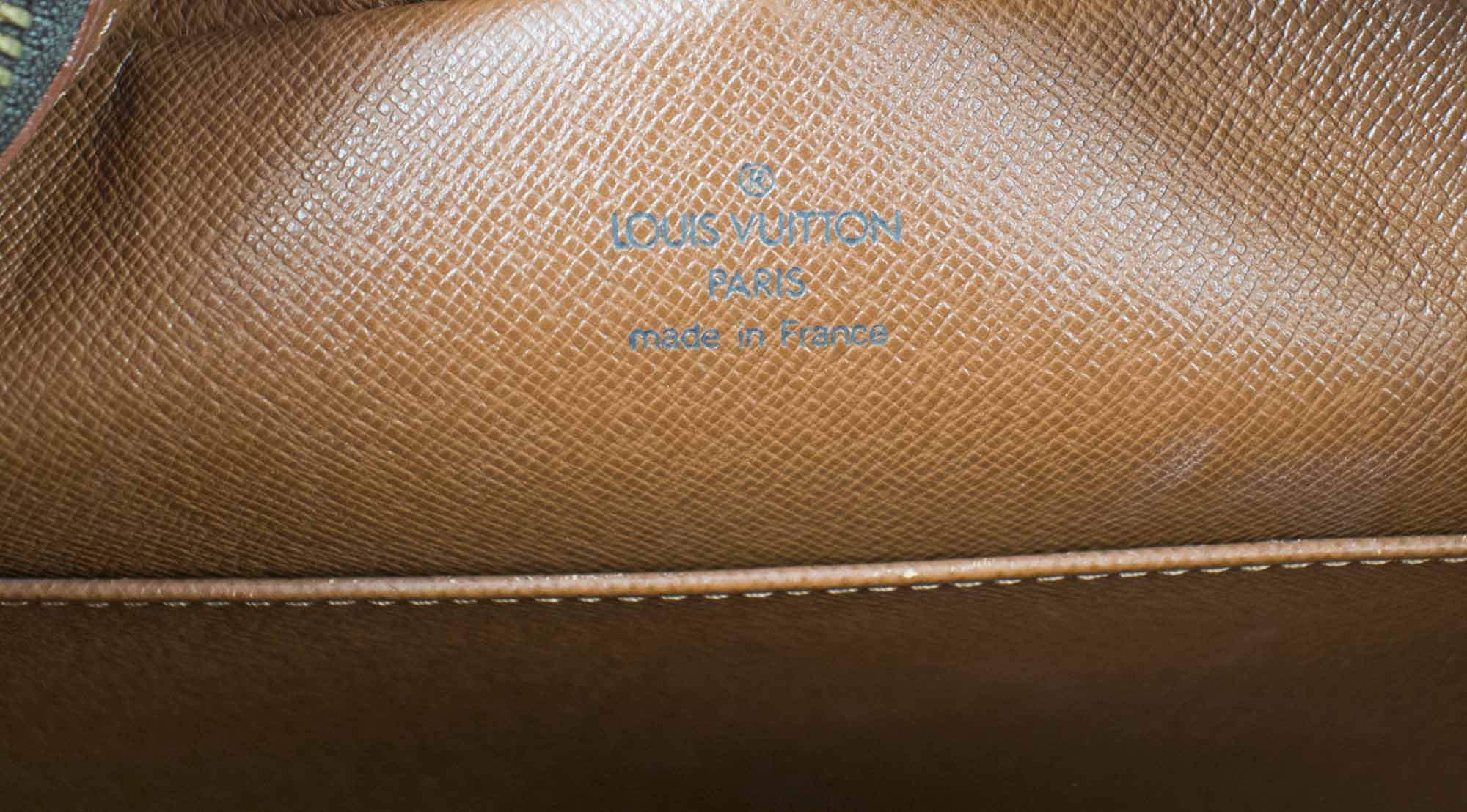 Cite cloth handbag Louis Vuitton Brown in Cloth - 36689947