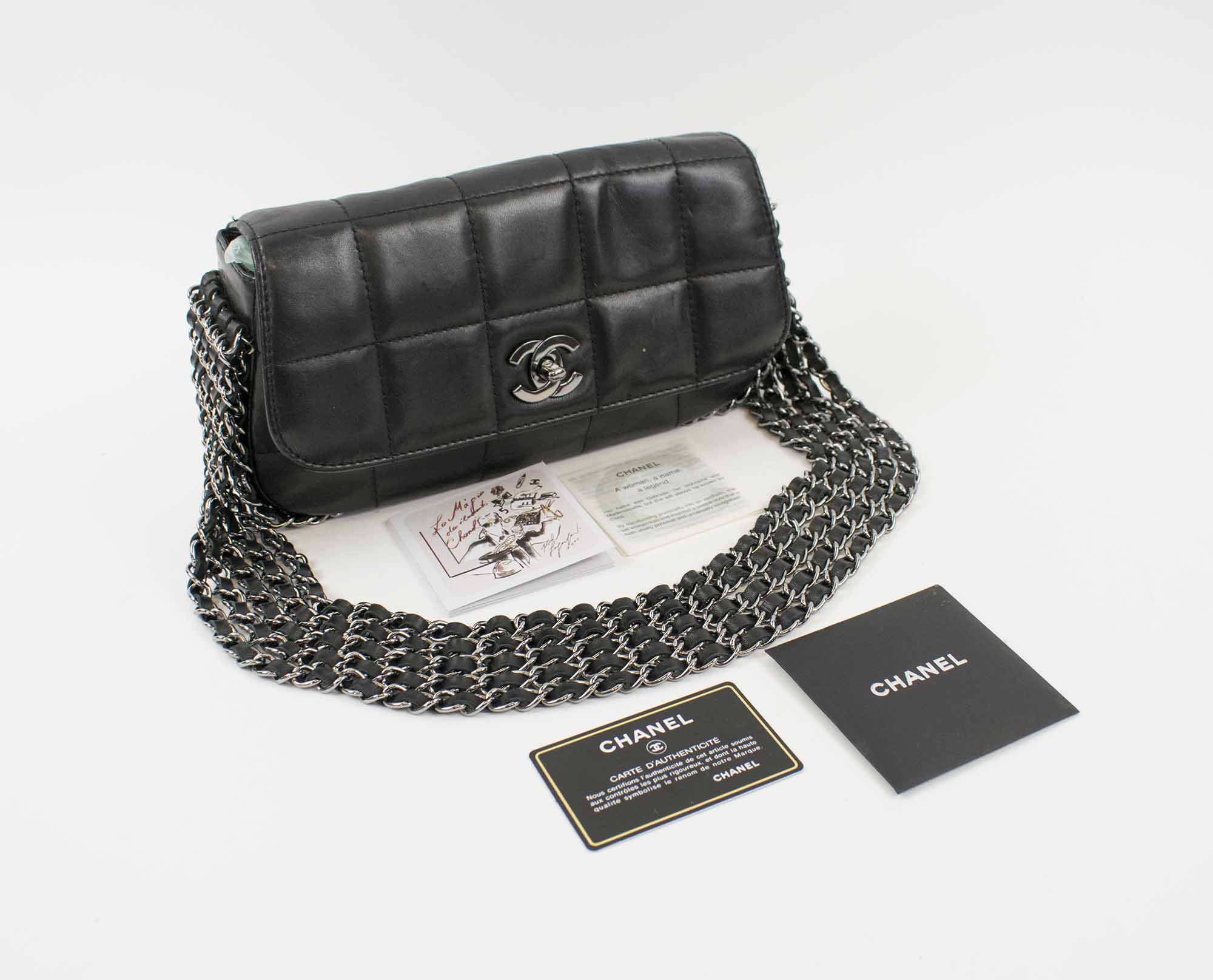CHANEL FIVE CHAIN FLAP BAG, quilted lambskin with five silver tone and  leather chains along the side and portion of the bottom, interlocked CC  lock, monogram fabric lining, authenticity card, 26cm x