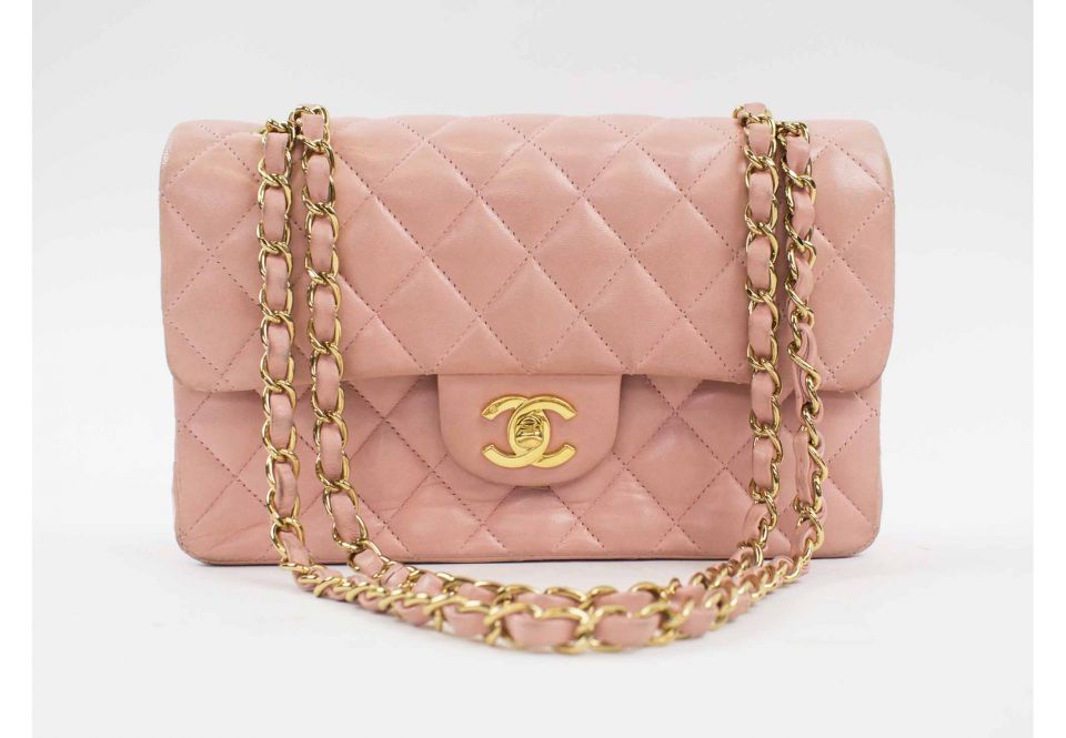 CHANEL SMALL CLASSIC FLAP HANDBAG, with quilted pink leather with  interlocked CC lock, gold tone hardware and leather woven chain strap,  authenticity card 9508026, with dust bag and box, 23cm x 6,5cm