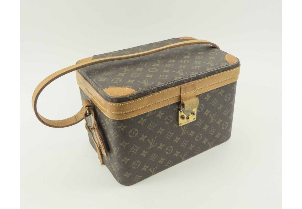 LOUIS VUITTON MONOGRAM VANITY CASE, with leather trims, shoulder strap and  name tag, gold tone hardware, push lock closure, inside a mirror, two  pockets and a leather strap, 32cm x 22cm H