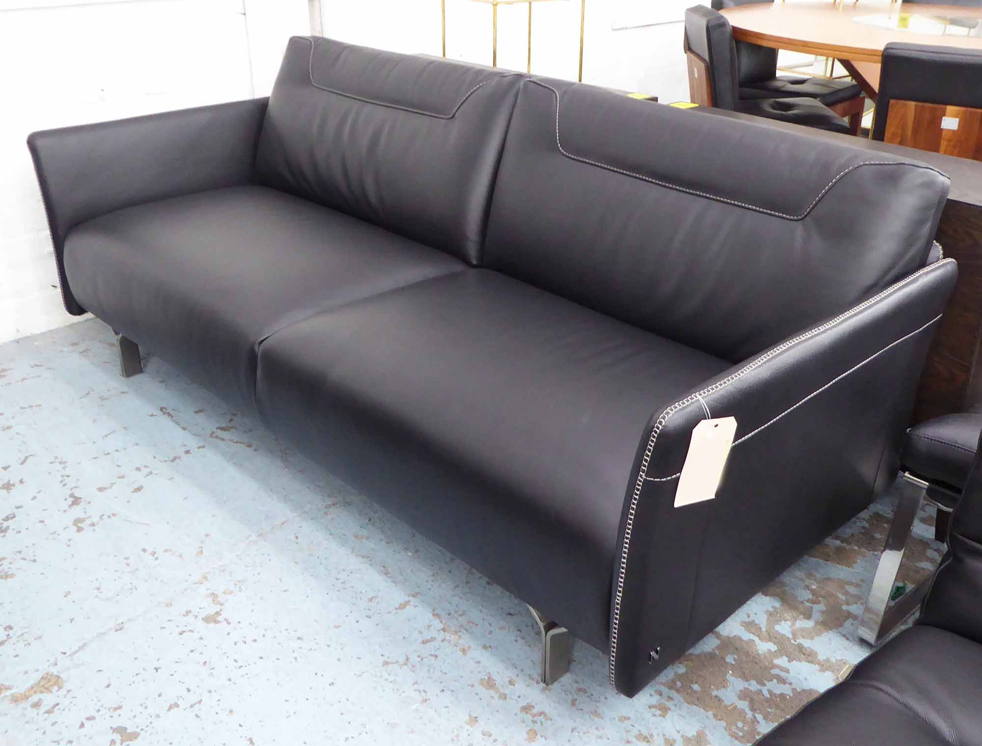 NATUZZI SOFA, two seater, in black stitched leather on