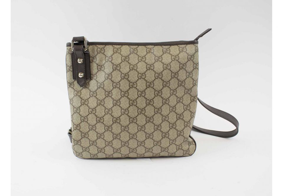 GUCCI CROSSBODY VINTAGE FLAT MESSENGER BAG, with iconic GG monogram canvas,  leather trims and adjustable strap, top zip closure, 25cm x 23cm H.