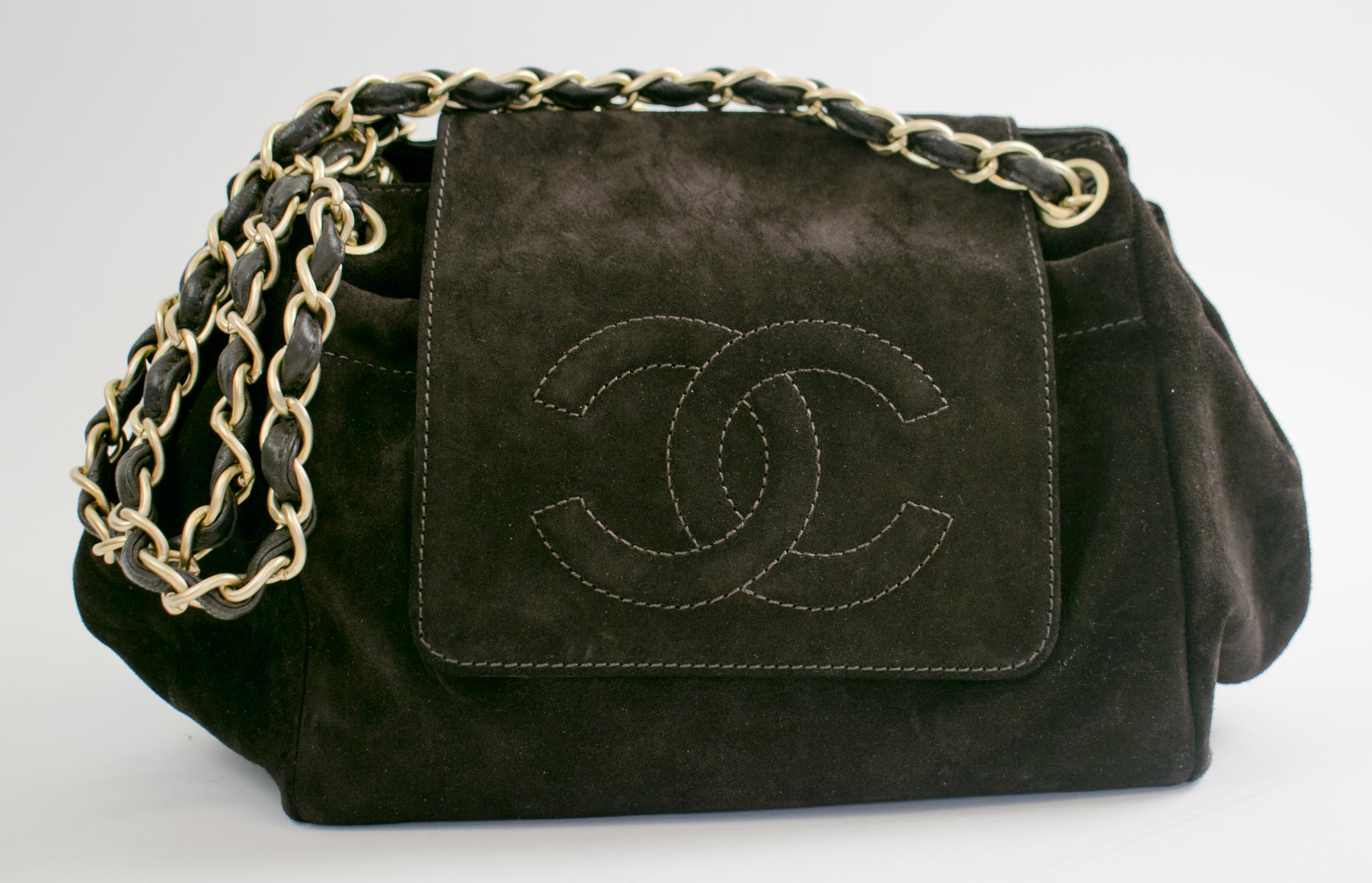CHANEL ACCORDION FLAP BAG, brown suede with intertwined CC logo on the flap,  snap closure, monogram fabric lining and leather interior, interwoven chain  strap, worn single or double strap, gold tone hardware