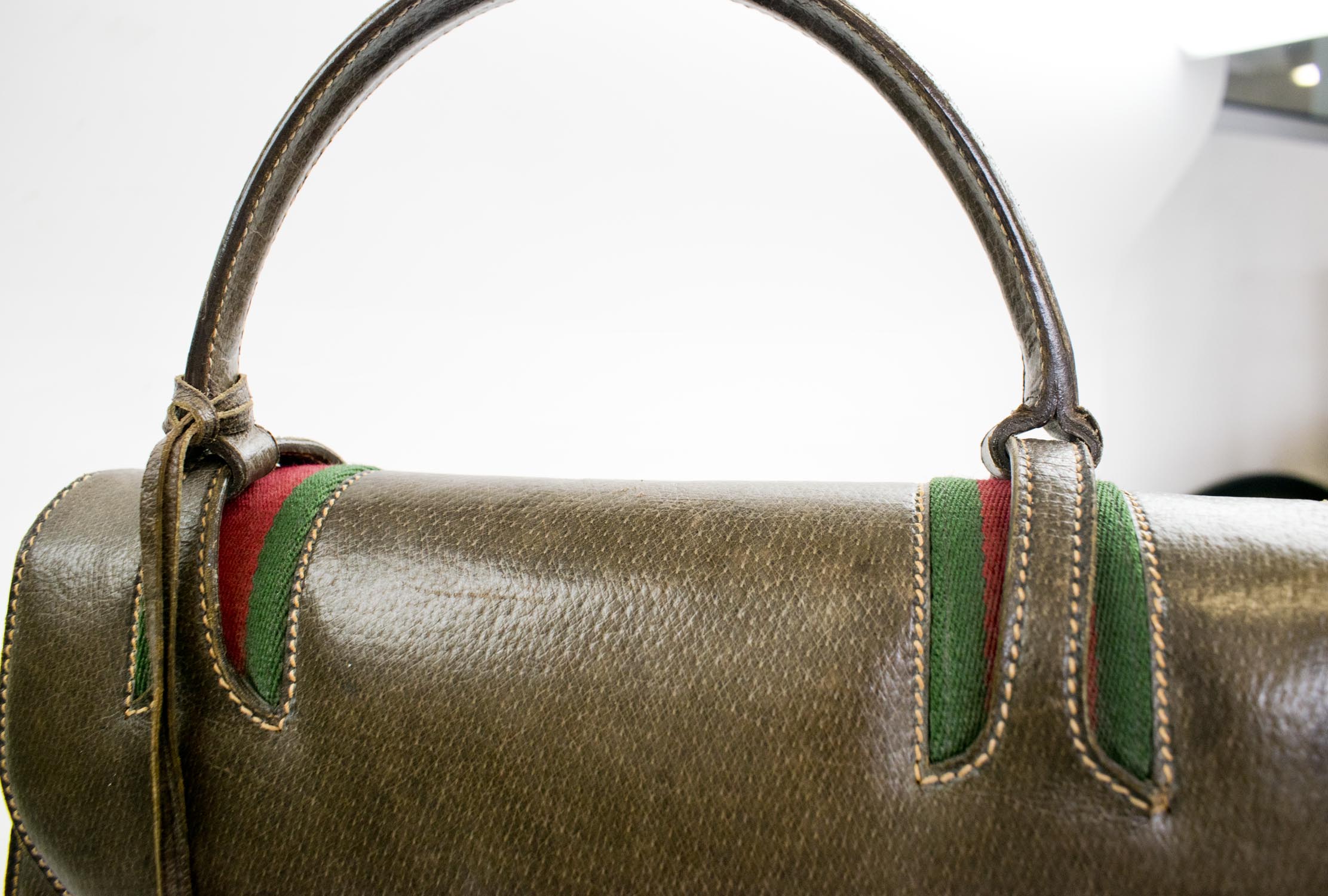 GUCCI VINTAGE BAGS, brown leather with single top handle, padlock, key and purse, iconic green