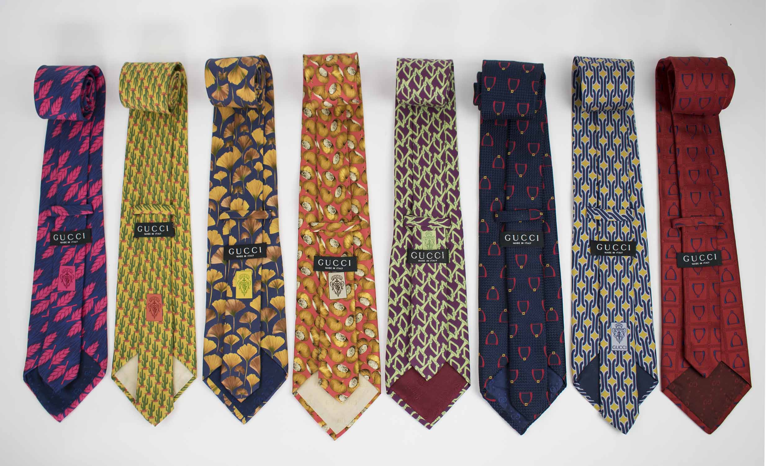 GUCCI TIES, a collection of eight patterned silk ties. (8)