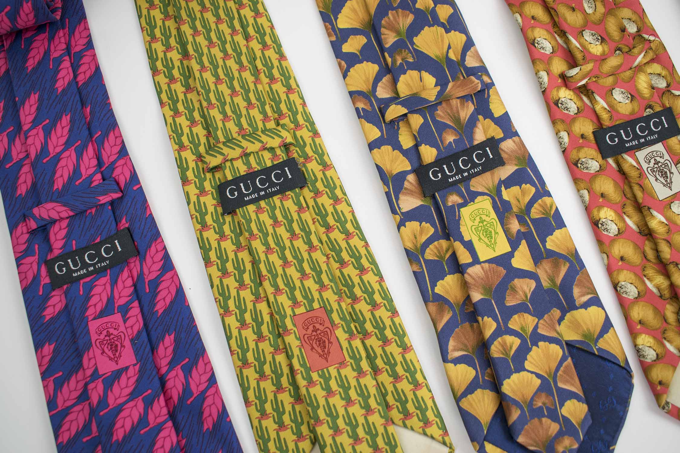 GUCCI TIES, a collection of eight patterned silk ties. (8)
