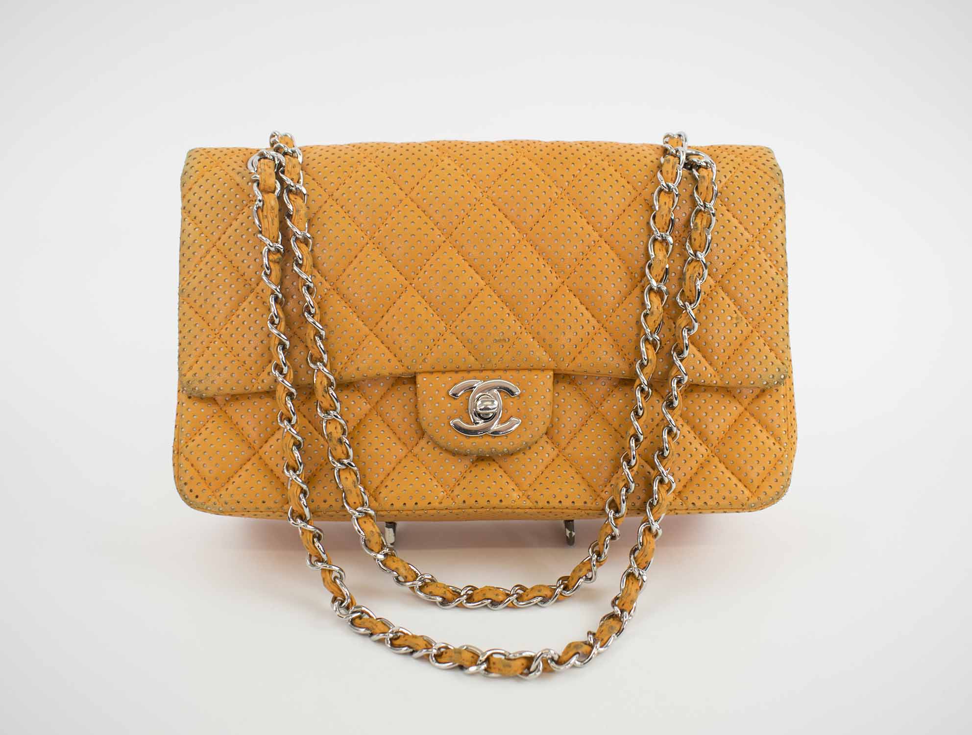 CHANEL LAMBSKIN PERFORATED DOUBLE FLAP BAG, with iconic diamond orange  quilted perforated leather, with silver tone hardware and CC turn lock, orange  leather lining, 2006-2008, authenticity card, 26cm x 15cm H.