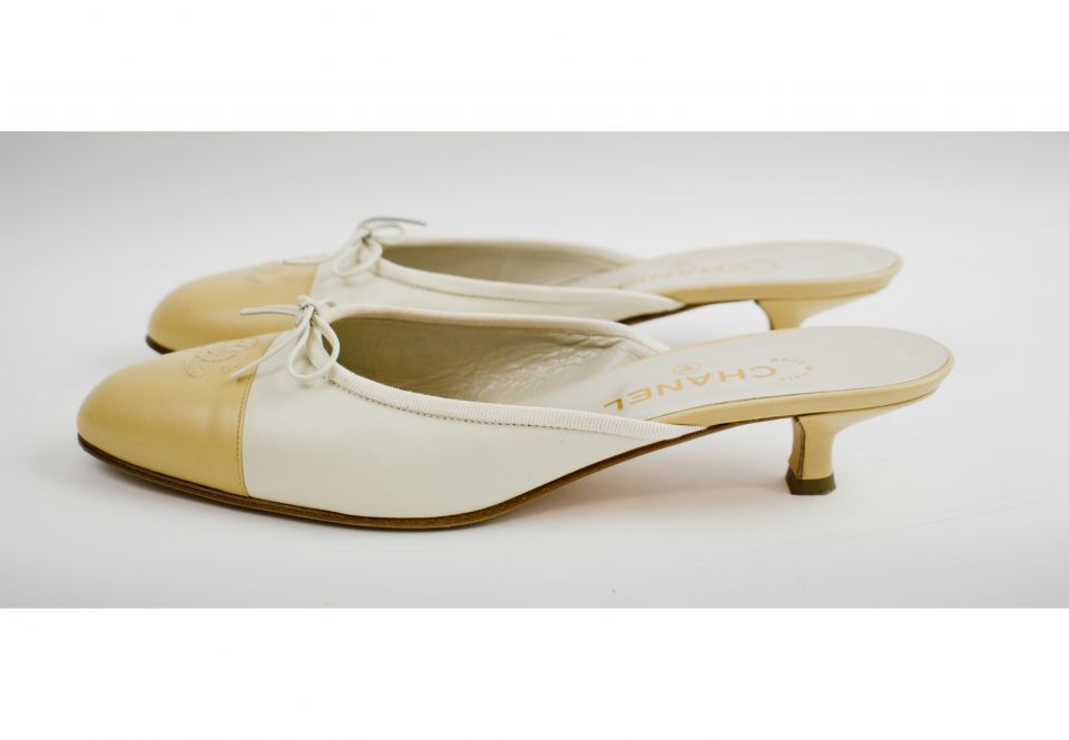 CHANEL MULES, colour latte leather with camel tone toe with iconic  intertwined CC logo at the front and bow, kitten heels 3cm, size 41 (8Uk).