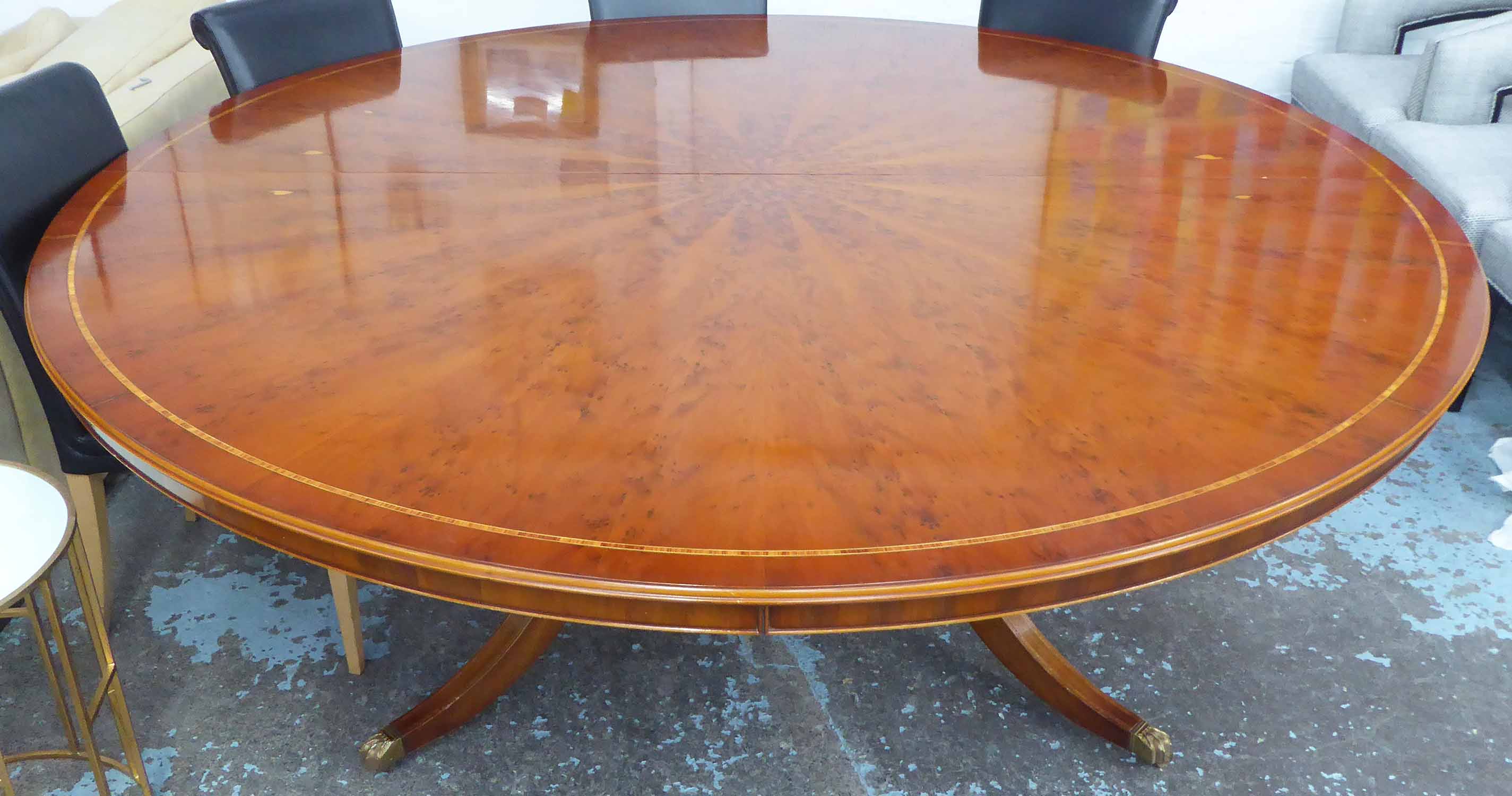 CIRCULAR DINING TABLE, with segmented yew veneer and band inlaid top ...
