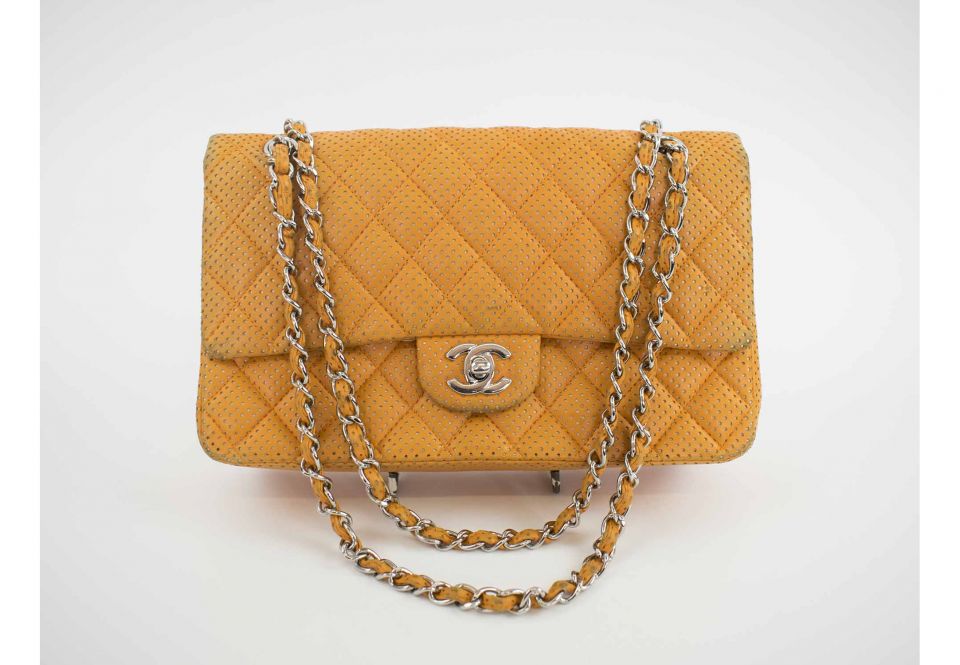 CHANEL LAMBSKIN PERFORATED DOUBLE FLAP BAG, with iconic diamond orange  quilted perforated leather, with silver tone hardware and CC turn lock,  orange leather lining, 2006-2008, authenticity card, 26cm x 15cm H.