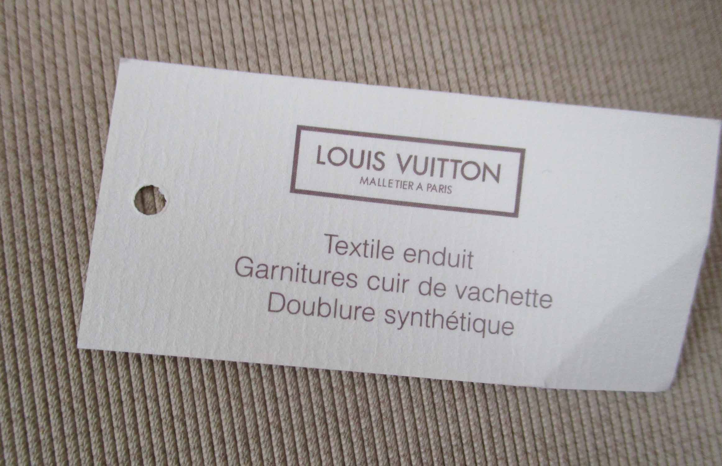 LOUIS VUITTON 'SIRIUS 70' MONOGRAM SUITCASE, plus original 'Saks Fifth  Avenue' bill of sale.