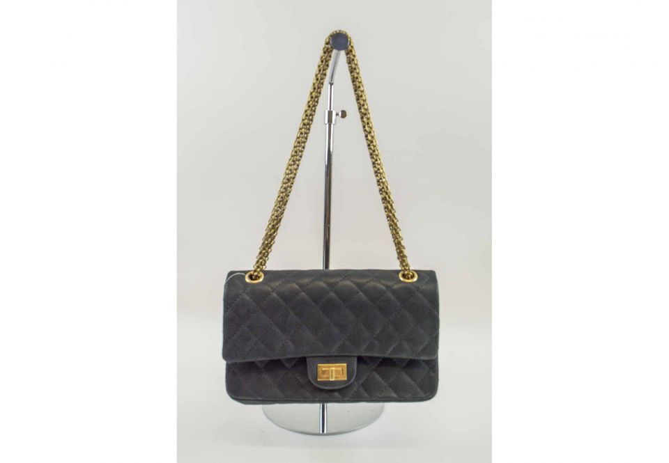 CHANEL 2.55 REISSUE, iconic black quilted pattern with leather