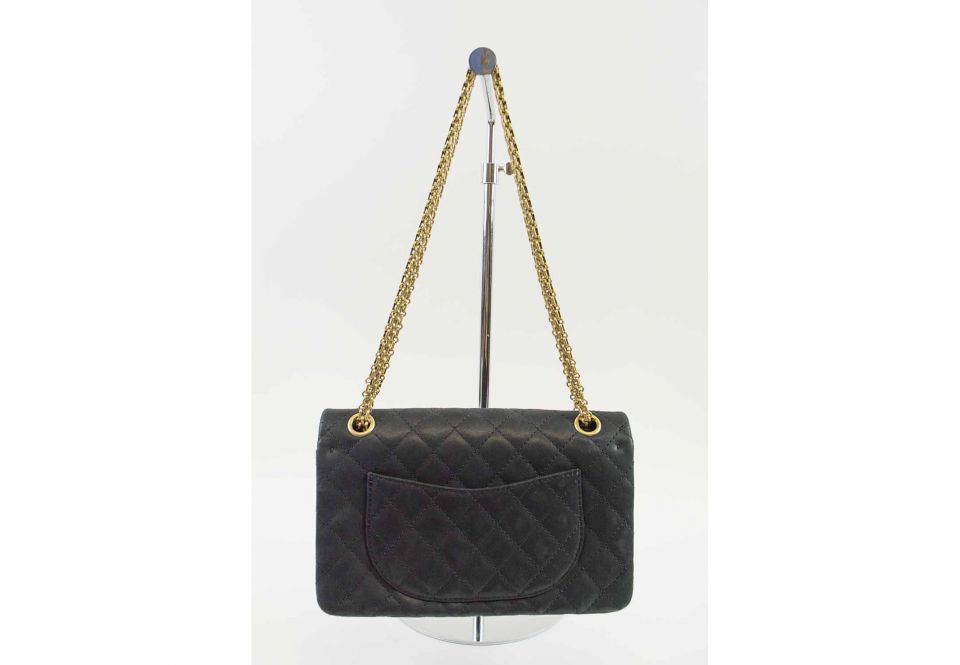 CHANEL 2.55 REISSUE, iconic black quilted pattern with leather lining,  double flap and mademoiselle lock, gold tone hardware and chain, inside  sticker, c. 2016/2017, with dust bag and box, 24cm x 15cm