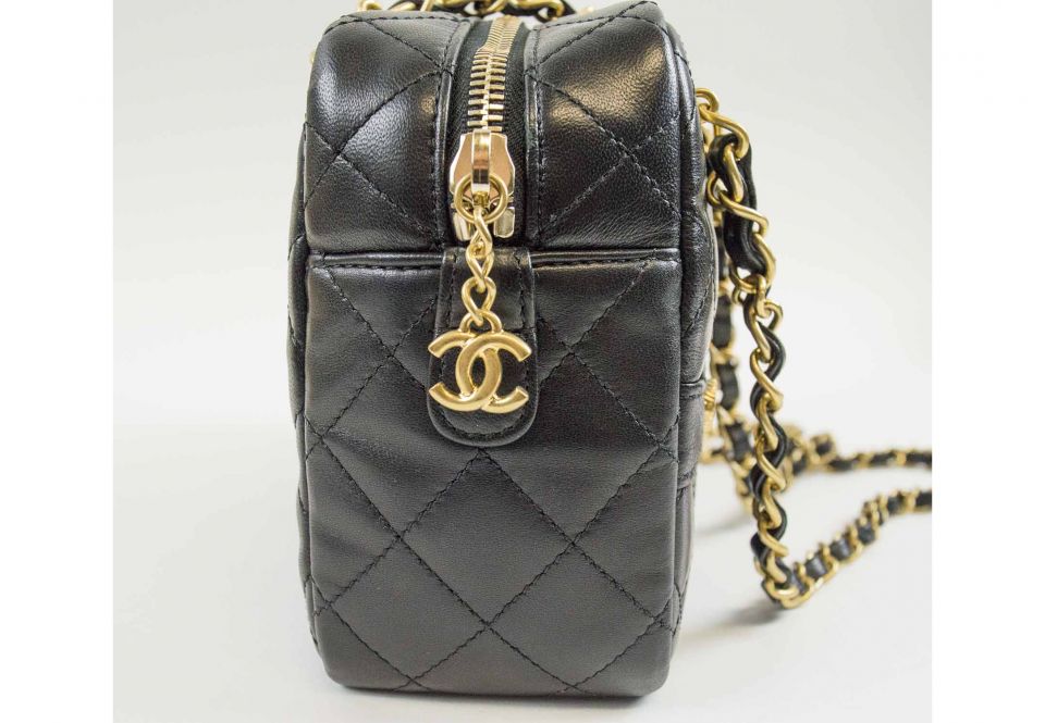 CHANEL 'JACKET' HANDBAG, iconic quilted black leather with gold tone  hardware, zip top closure, fabric lining, one snap front and one back  pocket, inside sticker, 25cm x 15cm H x 8cm.