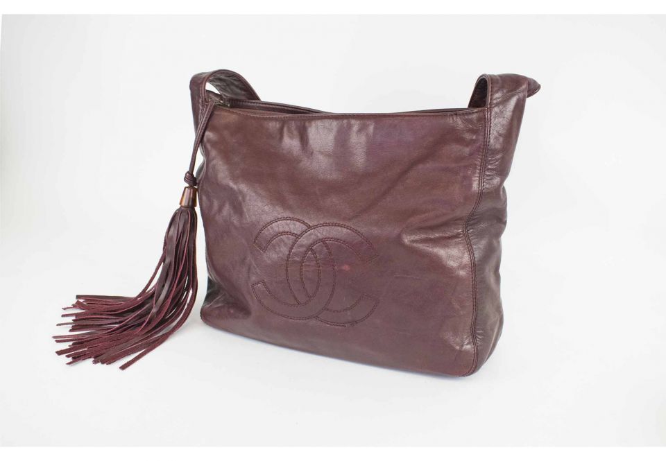 Lot 260 - A Louis Vuitton dark maroon patent leather