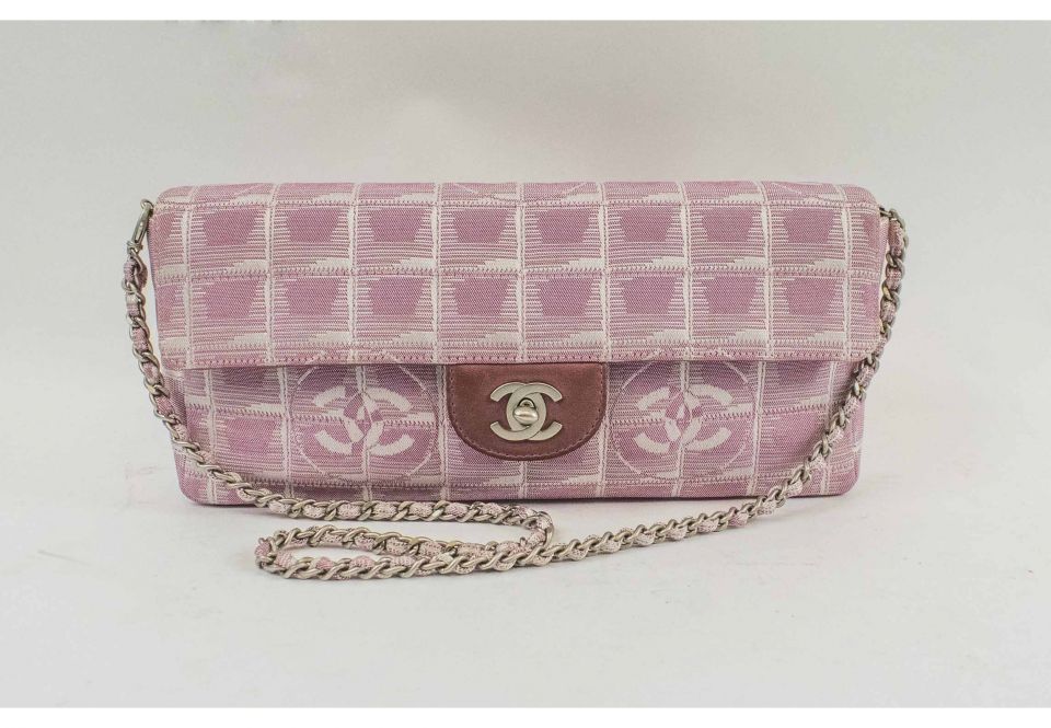 CHANEL EAST WEST FLAP BAG, with quilted 'chocolate bar' design pink canvas,  silver plated hardware, shoulder chain interwoven with leather, fabric  lining, authenticity card and inside sticker 2000-2002, 26cm x 13cm H.