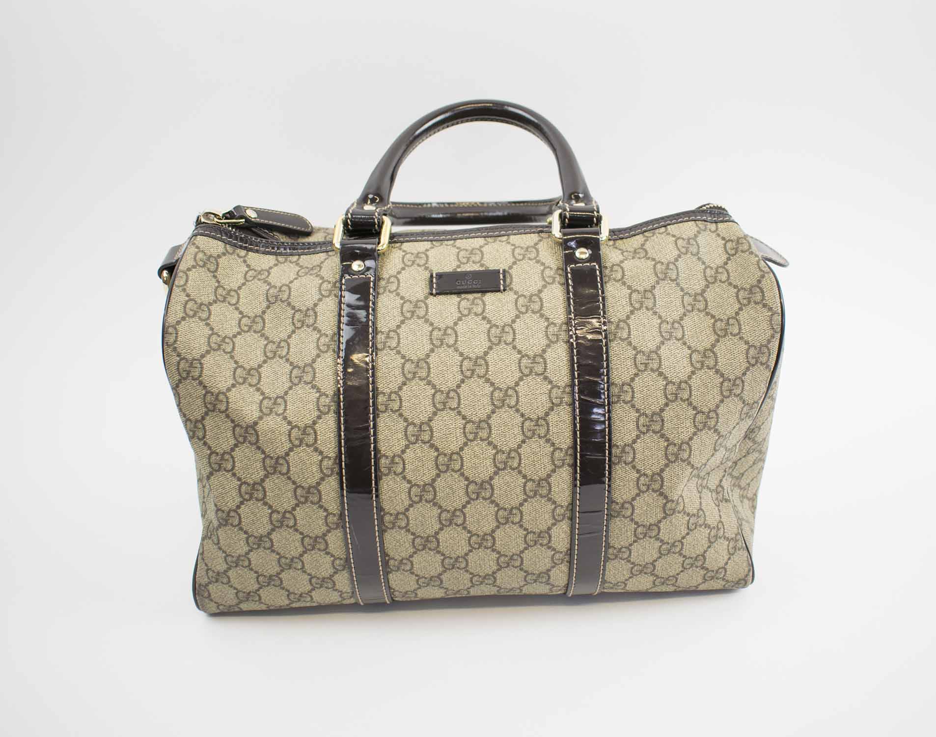 GUCCI BOSTON BAG, with iconic GG print coated canvas with patent leather  top handles and trims, top zip closure, pale gold tone hardware with dust  bag, 33cm x 22cm H x 18cm.
