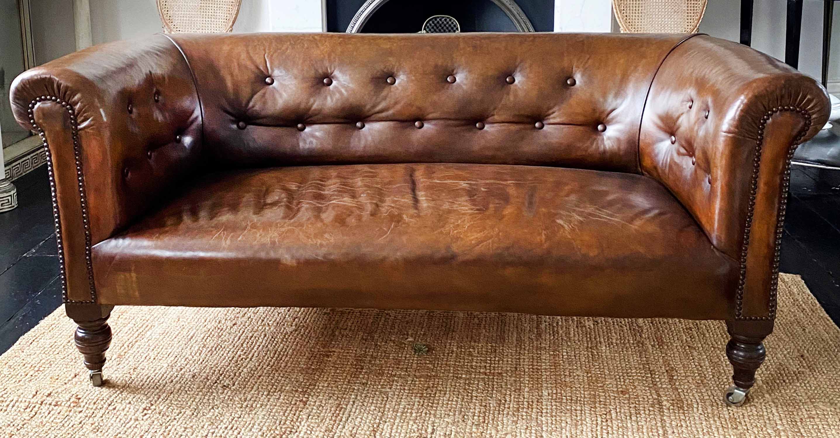 CHESTERFIELD SOFA, 19th century deep button curved back
