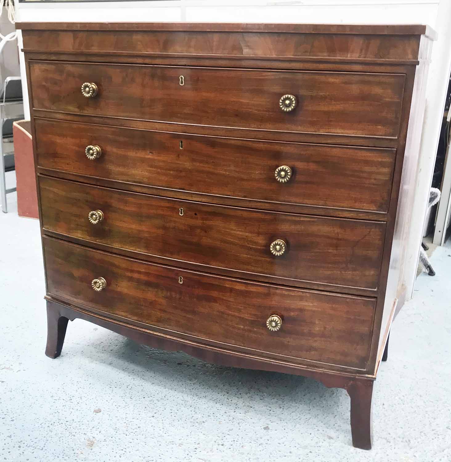 BOWFRONT CHEST, Regency mahogany, with four graduated drawers, on ...